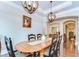 Formal dining room with decorative lighting, hardwood floors, and a traditional aesthetic at 15305 Fishhawk Preserve Dr, Lithia, FL 33547