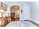 Elegant foyer with hardwood floors, arched doorway, and decorative lighting, offering a warm welcome at 15305 Fishhawk Preserve Dr, Lithia, FL 33547