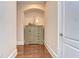 Hallway featuring a decorative cabinet with neutral tones, showcasing style and functionality at 15305 Fishhawk Preserve Dr, Lithia, FL 33547
