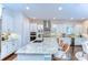 Gourmet kitchen features an oversized island, granite countertops, stainless steel appliances, and designer backsplash at 15305 Fishhawk Preserve Dr, Lithia, FL 33547