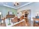 Inviting living room featuring hardwood floors, a decorative wall, and a seamless flow into the foyer at 15305 Fishhawk Preserve Dr, Lithia, FL 33547