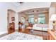 Bright and spacious living room with hardwood floors, large windows, and comfortable seating, great for entertaining at 15305 Fishhawk Preserve Dr, Lithia, FL 33547
