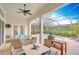 Inviting outdoor patio with comfortable seating, dining area, grill, and view of the sparkling pool at 15305 Fishhawk Preserve Dr, Lithia, FL 33547