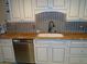 Bright kitchen with stainless steel dishwasher and bronze fixtures at 15400 Gulf Blvd # 502, Madeira Beach, FL 33708