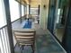 Relaxing screened lanai with comfortable seating and turtle-themed decor for outdoor enjoyment at 15400 Gulf Blvd # 502, Madeira Beach, FL 33708