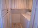 Convenient laundry room equipped with a washer, dryer, and ample storage cabinets at 15400 Gulf Blvd # 502, Madeira Beach, FL 33708