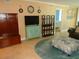Cozy living room featuring tile floors, unique decor, and a view into a bedroom at 15400 Gulf Blvd # 502, Madeira Beach, FL 33708