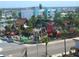 Aerial view of mini golf course with pirate ship theme in a touristy town at 15400 Gulf Blvd # 502, Madeira Beach, FL 33708