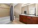 Bathroom featuring a double sink vanity and tiled shower and bathtub combination at 16621 Kingletside Ct, Lithia, FL 33547