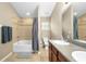 Bathroom featuring a single sink vanity and tiled shower and bathtub combination at 16621 Kingletside Ct, Lithia, FL 33547