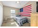 This bedroom has a patriotic theme, with an American flag and desk at 16621 Kingletside Ct, Lithia, FL 33547