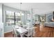 Light-filled dining area features hardwood floors and serene color palette at 16621 Kingletside Ct, Lithia, FL 33547