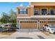 A charming multi-story home with a two-car garage, stone accents, and a balcony on the second floor at 16621 Kingletside Ct, Lithia, FL 33547