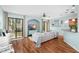 Comfortable living room with wood flooring, stylish furniture, and windows overlooking the backyard at 16621 Kingletside Ct, Lithia, FL 33547
