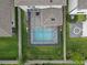 A beautiful home featuring a fenced backyard with a screened-in pool and meticulously landscaped garden at 19926 Stone Pine Cir, Lutz, FL 33558