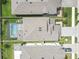 Aerial view of home showing roof, fenced backyard with pool and an outdoor firepit area at 19926 Stone Pine Cir, Lutz, FL 33558