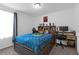 Charming bedroom features a modern bed and desk, soft natural light, and decorations at 19926 Stone Pine Cir, Lutz, FL 33558