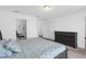 Bright bedroom featuring a bed with storage drawers, dresser, and bonus office space at 19926 Stone Pine Cir, Lutz, FL 33558