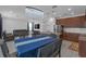Open-concept dining room, kitchen and living room with elegant chandelier at 19926 Stone Pine Cir, Lutz, FL 33558