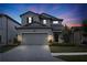 Beautiful two-story home featuring a paved driveway, two car garage and manicured front yard at 19926 Stone Pine Cir, Lutz, FL 33558