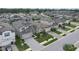 Overhead view of several homes with well-kept lawns, paved driveways, and manicured landscaping at 19926 Stone Pine Cir, Lutz, FL 33558