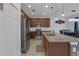 Kitchen featuring granite countertops, stainless steel appliances, and pendant lighting at 19926 Stone Pine Cir, Lutz, FL 33558