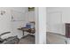 Home office featuring a workspace, shelving, and view to the bedroom at 19926 Stone Pine Cir, Lutz, FL 33558