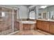 Bathroom showcasing a glass enclosed shower, soaking tub and tile flooring at 20537 Lace Cascade Rd, Land O Lakes, FL 34637