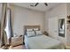 Bright bedroom featuring a ceiling fan, a cozy bed and a window letting in natural light at 20537 Lace Cascade Rd, Land O Lakes, FL 34637