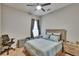 Comfortable bedroom featuring a modern ceiling fan, a cozy bed and a window letting in natural light at 20537 Lace Cascade Rd, Land O Lakes, FL 34637