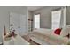 Bright bedroom featuring a comfortable bed, closet, shelf and window letting in natural light at 20537 Lace Cascade Rd, Land O Lakes, FL 34637