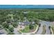 Aerial view of a large clubhouse and community center surrounded by trees and landscaping at 20537 Lace Cascade Rd, Land O Lakes, FL 34637