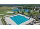 Aerial image of a large community pool and tennis courts, providing ample recreational activities and space at 20537 Lace Cascade Rd, Land O Lakes, FL 34637