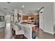 Open-concept kitchen with granite countertops, stainless steel appliances, and barstool seating at 20537 Lace Cascade Rd, Land O Lakes, FL 34637
