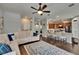 Spacious open-concept living room with hardwood flooring and a view of the kitchen area at 20537 Lace Cascade Rd, Land O Lakes, FL 34637