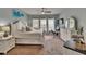 Comfortable main bedroom featuring a ceiling fan, a bed with storage and natural light at 20537 Lace Cascade Rd, Land O Lakes, FL 34637