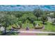 Beautiful neighborhood entrance showcasing lush landscaping and mature trees for a welcoming atmosphere at 20537 Lace Cascade Rd, Land O Lakes, FL 34637