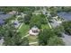 Aerial view of a neighborhood gazebo surrounded by mature trees and well-maintained green space at 20537 Lace Cascade Rd, Land O Lakes, FL 34637