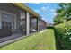 View of screened-in patio with hammock and backyard, offering a private retreat for relaxation and outdoor enjoyment at 20537 Lace Cascade Rd, Land O Lakes, FL 34637