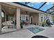 Large, covered patio is perfect for entertaining, lounging, or relaxing in a hammock at 20537 Lace Cascade Rd, Land O Lakes, FL 34637
