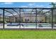 Screened pool with spa, water feature and lounge chairs at 20537 Lace Cascade Rd, Land O Lakes, FL 34637