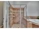 Bathroom with a glass-enclosed shower and a soaking tub at 20537 Lace Cascade Rd, Land O Lakes, FL 34637