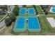 Aerial view of the blue tennis and basketball courts, offering recreational opportunities for active residents at 20537 Lace Cascade Rd, Land O Lakes, FL 34637