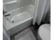 Clean white bathroom features a tub with shower and a white shower curtain at 2108 E 22Nd Ave # 1, Tampa, FL 33605
