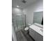 Bathroom features a glass enclosed shower, toilet, and vanity with granite countertop at 2108 E 22Nd Ave # 1, Tampa, FL 33605