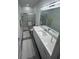Modern bathroom featuring stone countertops, a toilet, and a glass-enclosed shower at 2108 E 22Nd Ave # 1, Tampa, FL 33605