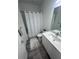 Clean bathroom with a shower/tub combo, modern vanity, and neutral color scheme for a calming atmosphere at 2108 E 22Nd Ave # 1, Tampa, FL 33605