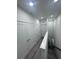 Hallway features vinyl floors, white walls and doors, and a staircase down at 2108 E 22Nd Ave # 1, Tampa, FL 33605