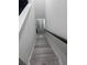 Stairway with gray flooring and white walls, leading to another part of the home at 2108 E 22Nd Ave # 1, Tampa, FL 33605