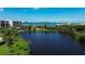 Community with serene lake and lush landscaping overlooking the city and ocean at 220 Belleview Blvd # 104, Belleair, FL 33756